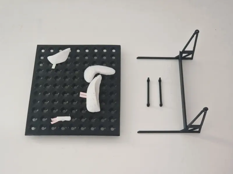 A photo of the parts of the board, along with a sample route.