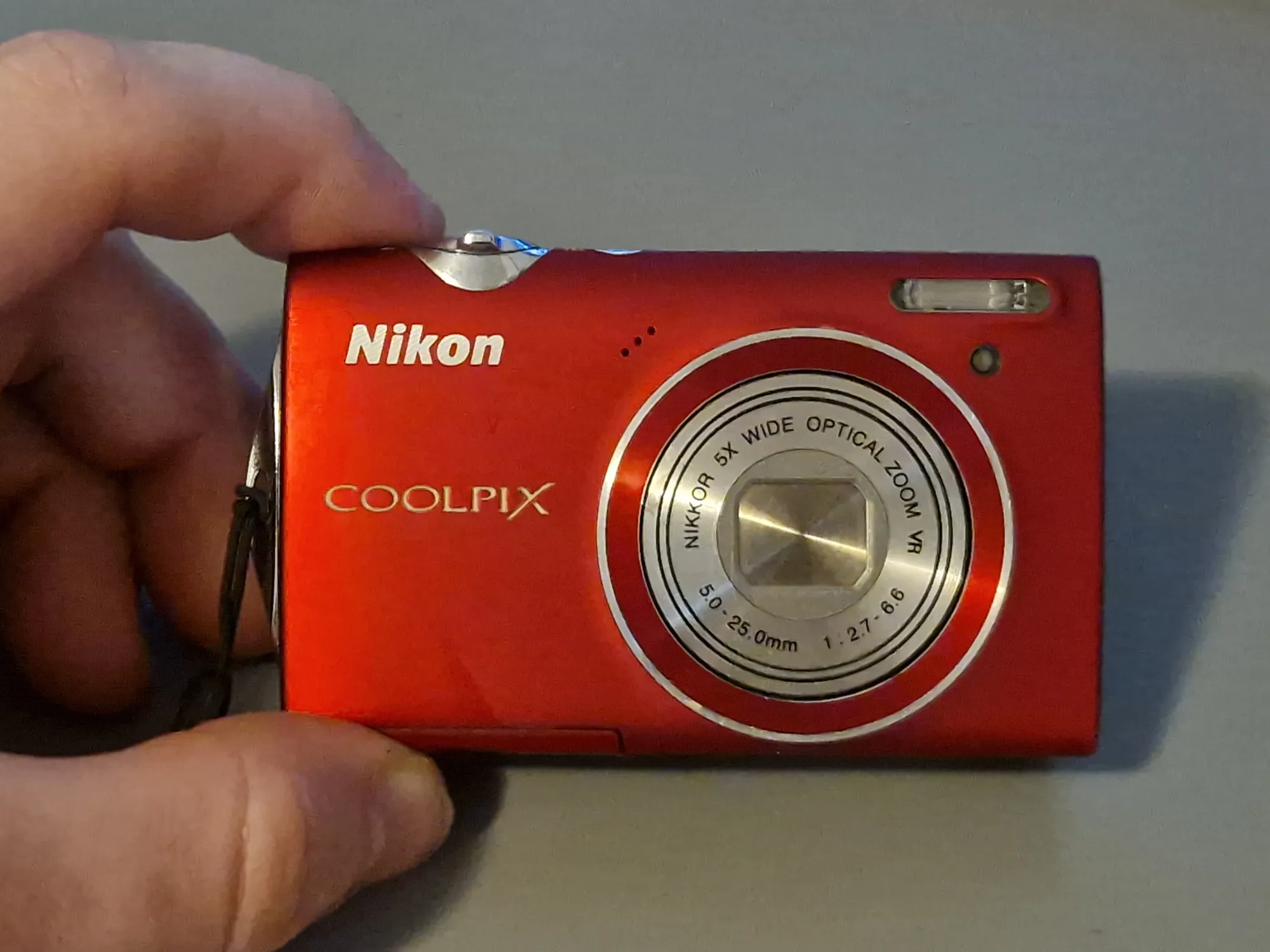 Image of a Nikon Coolpix S5100 handheld camera.