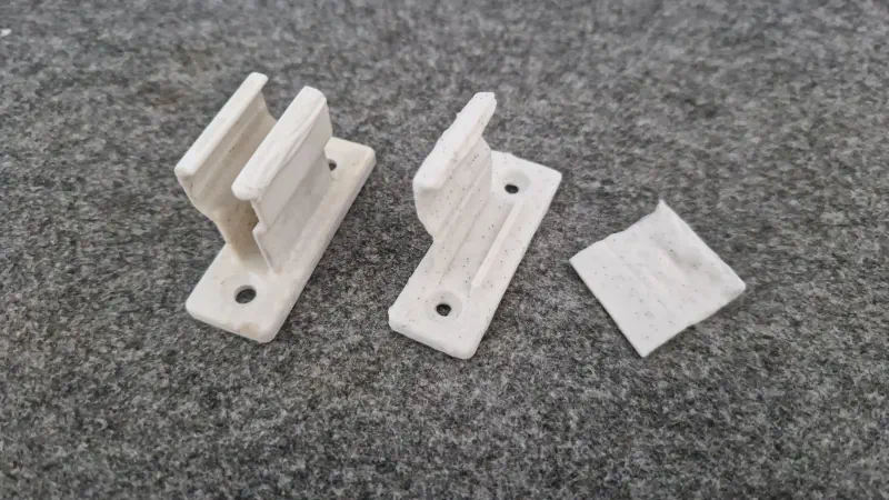 A working holder, and the broken one.