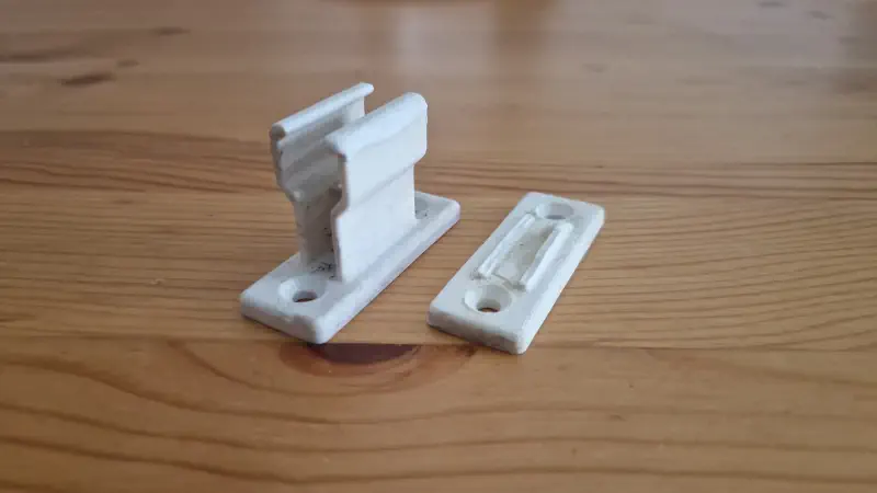 A working holder, and the broken one.